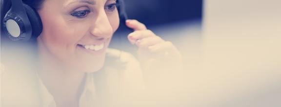 Smiling woman wearing phone headset