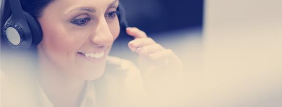 Smiling woman wearing phone headset